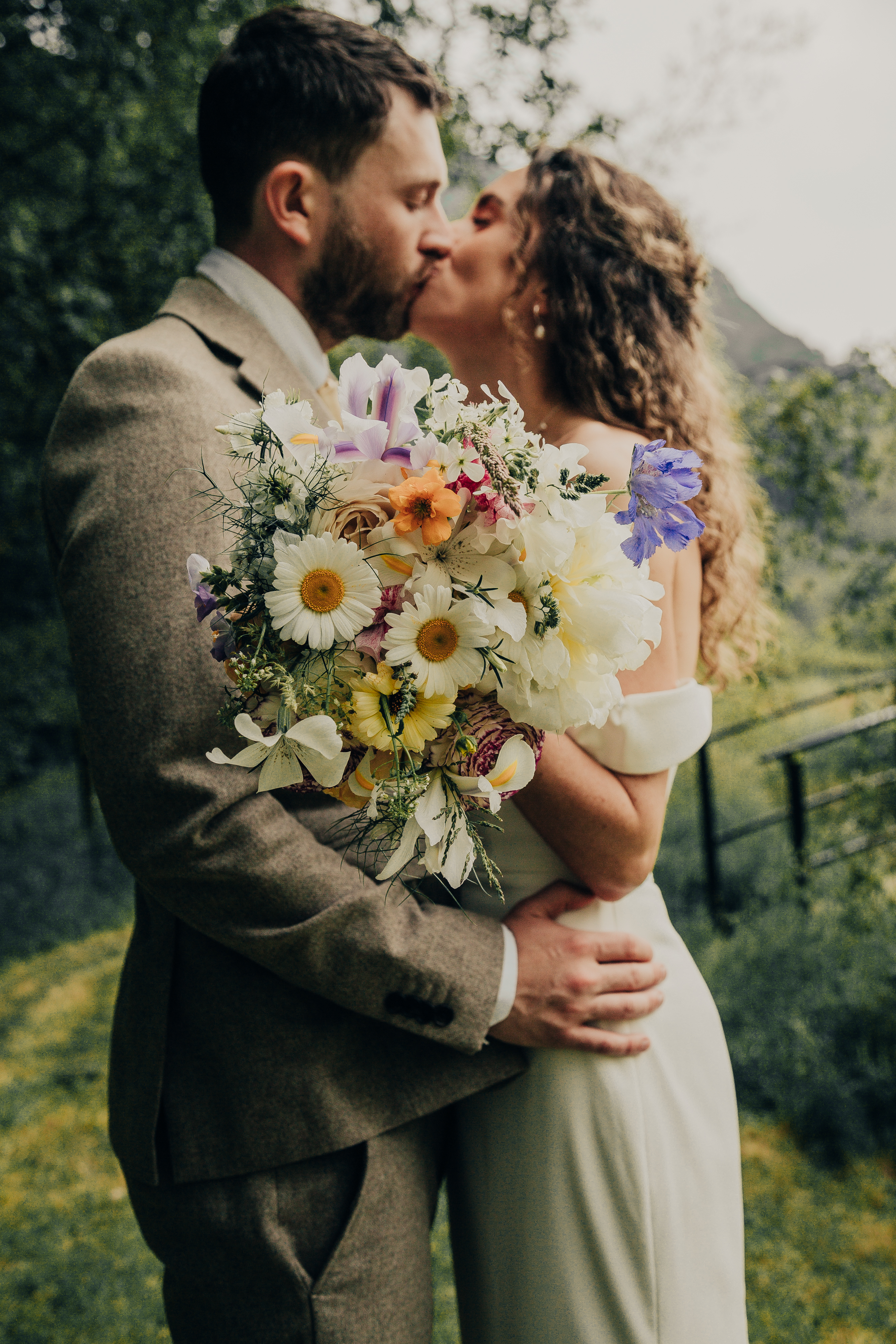 Bride and Groom with bridal bouquet by The Dahlia Wood